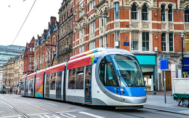 Fototapeta na wymiar City tram on a street of Birmingham in England