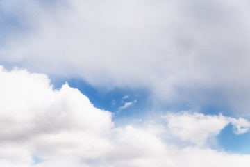 Scenic sky background. Blue sky with fluffy white clouds