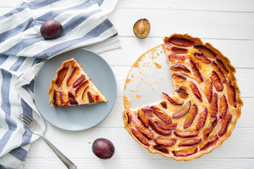 Delicious fruit pie with cream, tasty summer dessert, top view.