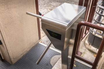 turnstile at the entrance of a funicular station