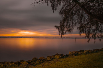 quiet sunrise view surrounded by trees