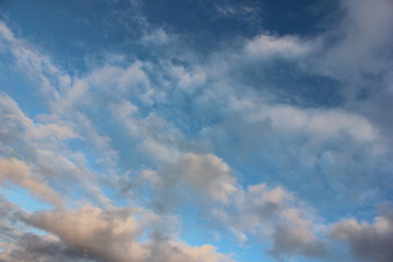 Naklejka na ściany i meble The photo shows clouds against a blue sky