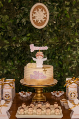 Baby baptism. Cake table with sweets and decoration
