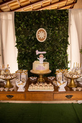 Baby baptism. Cake table with sweets and decoration
