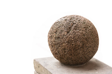 Bas-relief on one of the walls of Cracow. Stone ball on a pedestal, in the Cracow Palace. White background.