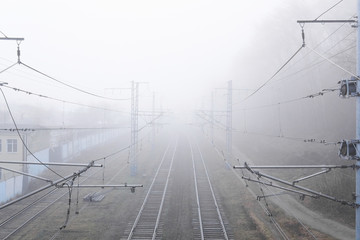 railroad rails lurking in fog