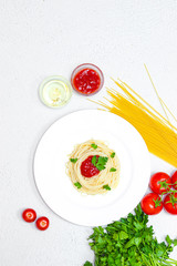spaghetti on a plate with ketchup and herbs. pasta spaghetti with vegetables ketchup from vegetables Italian food healthy food. restaurant food concept. food for the menu. vegetarian