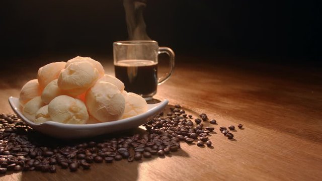 Brazilian cheese bread. Breakfast table with cheese bread, coffee, sugar and cake