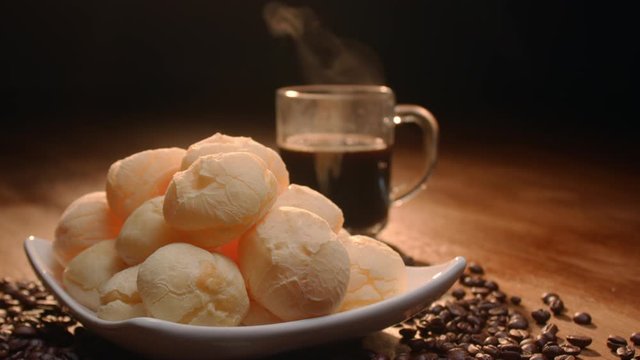 Brazilian cheese bread. Breakfast table with cheese bread, coffee, sugar and cake
