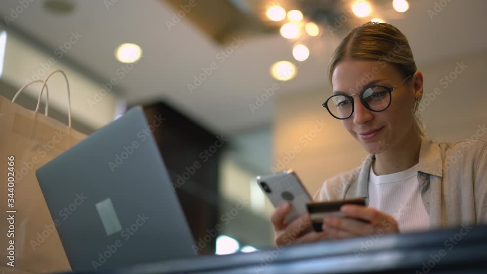 Aufkleber millennial woman in optical glasses browsing internet websites and making cellphone application for 