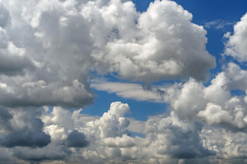 Naklejka na ściany i meble Clouds on the blue sky. Background with clouds. Dramatic clouds.