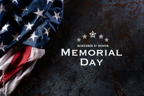 Happy Memorial Day. American flags with the text REMEMBER & HONOR against a black stone texture background. May 25.