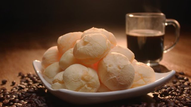 Brazilian cheese bread. Breakfast table with cheese bread, coffee, sugar and cake