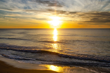 Fototapeta na wymiar Golden sunset over the Pacific Ocean in California