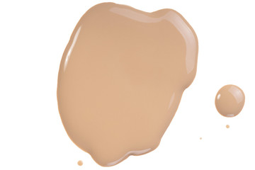 Liquid concealer smear smudge swatch drop isolated on white. Make up correction beige tone cream, foundation sample round shape.