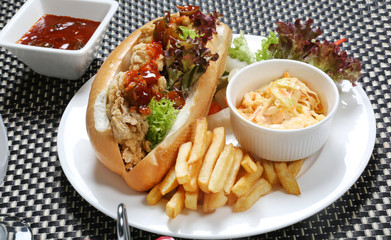 Chicken zinger sandwich served with coleslaw and French fries potato fry 