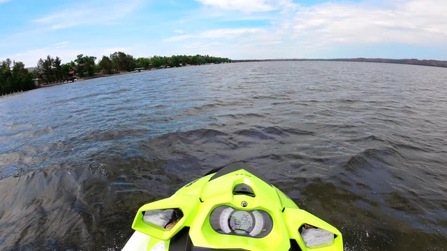 Point Of View (POV) GoPro Shot Of Man On A Jetski Watercraft Riding On A Lake On A Sunny Day, Enjoying Fun Summer Excitement On The Water.