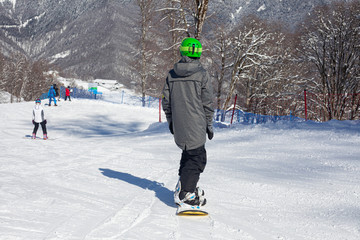 Snowboarder on a snowy slope.