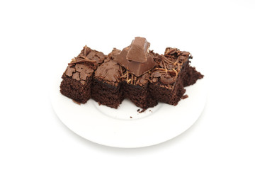 Slice chocolate brownies cake isolated on white