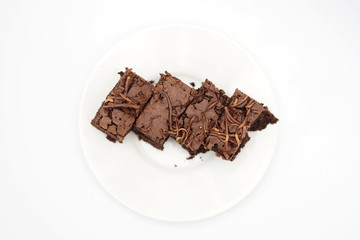 Slice chocolate brownies cake isolated on white