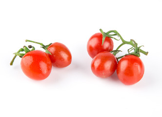 Fresh cherry tomatoes isolated on white background.