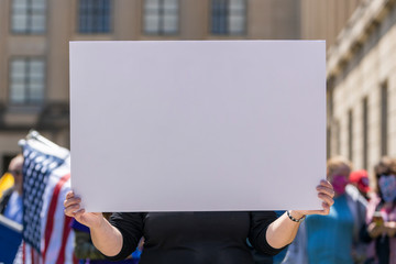 Protest in America, woman holding a blank card