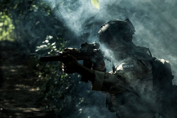 US Army ranger soldiers in a smoke.
