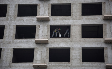 Buildings under construction in China consume most of the income of ordinary people