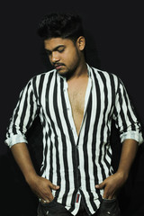 smart looking young man model wearing casual shirt with black isolated background