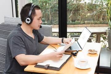 Work from home,Businessman working remotely from home. Using computer. Distance learning online education and work