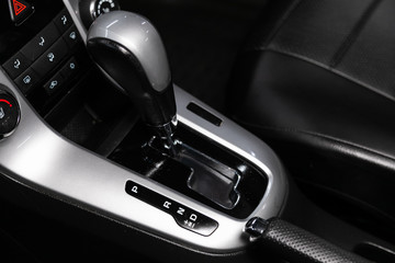 close-up of the accelerator handle and buttons. automatic transmission gear of car , car interior.