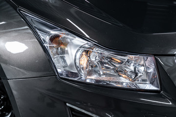 Beauty clean headlights of gray SUV. close up of modern car xenon lamp headlight.