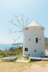 Fototapeta na wymiar Greek Windmill. Roadside station 