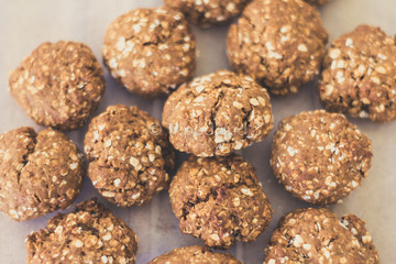 topview of homemade oat cookies on bakery paper