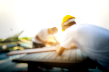 blurred  carpenter man standing and working