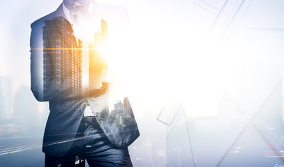 Double exposure image of businessman with city view.The boss have vision and leadership for...