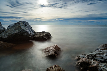sunset at rocky shore seascape scene