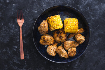 plant-based food, vegan buffalo cauliflower florets and grilled corn cobs