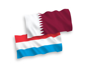 Flags of Qatar and Luxembourg on a white background