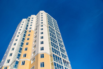 the top of a skyscraper against the blue sky