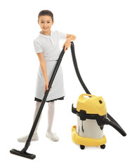 Cute little chambermaid with vacuum cleaner on white background