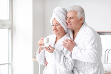 Morning of mature couple in bathroom