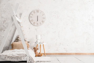 Interior of modern children's room with comfortable bed