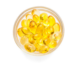 Bowl with fish oil capsules on white background