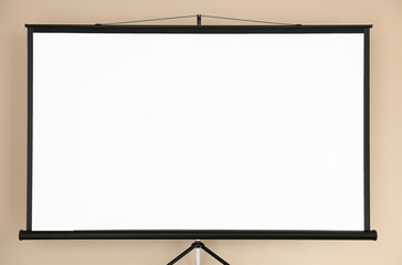 Modern projector screen on color background