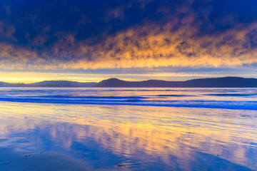 Obraz na płótnie Canvas Stratocumulus Cloud Covered Sunrise Seascape