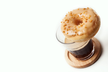 Glass of coffee and donut
