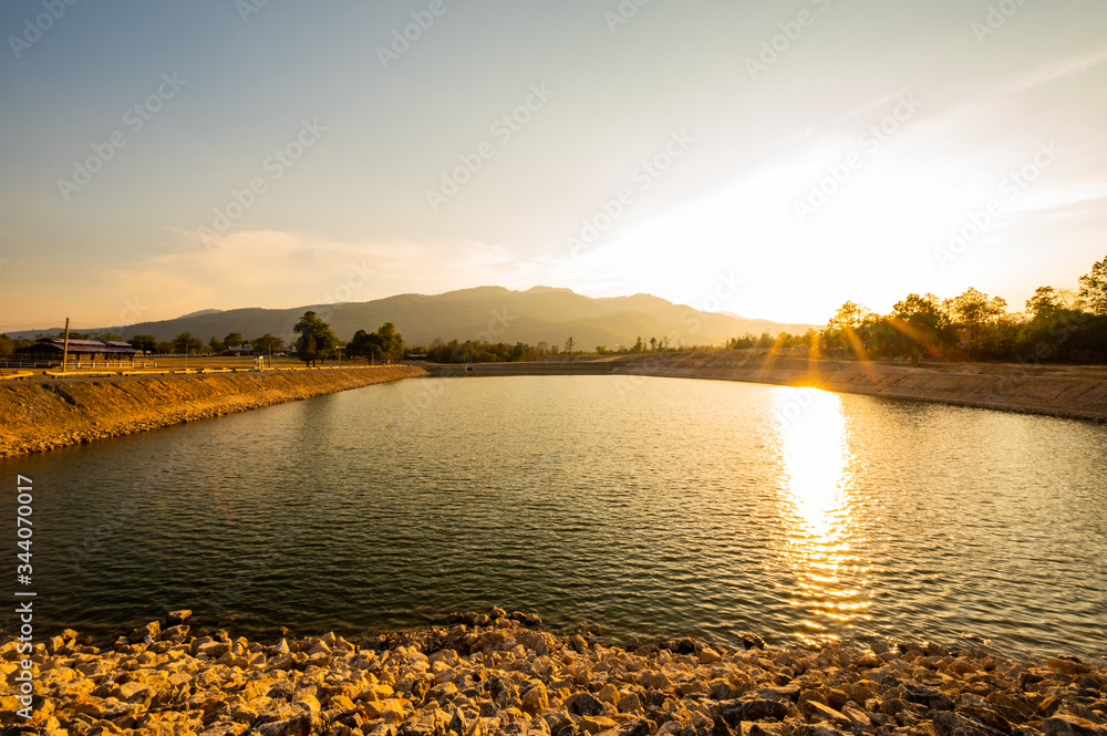 Canvas Prints Reservoir with mountain view at sunset