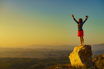 Woman enjoy landscape with arms up