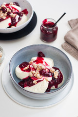 Cottage cheese pancakes with berry sauce and nuts. Healthy breakfast concept.
